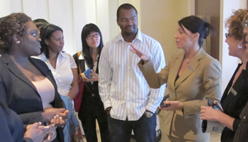 Students listening to hotel executive on venue tour